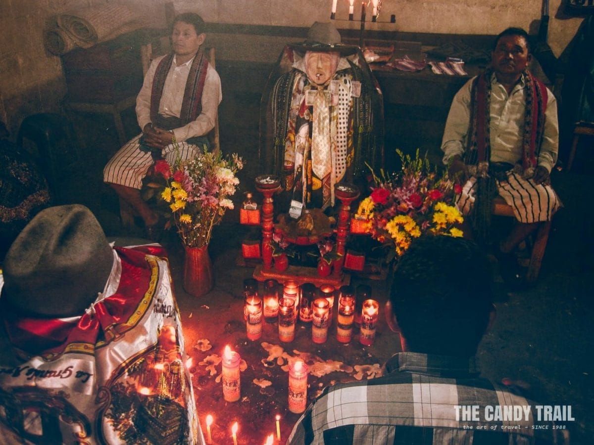shrine of maya god maximon and maya ceremony at santiago atitlan in guatemala