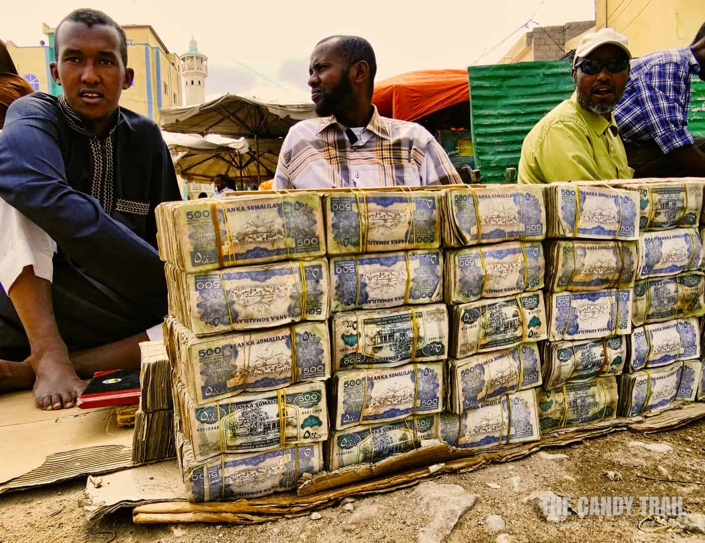 cash vendors with bundles of money in hargeisa market in Somaliland