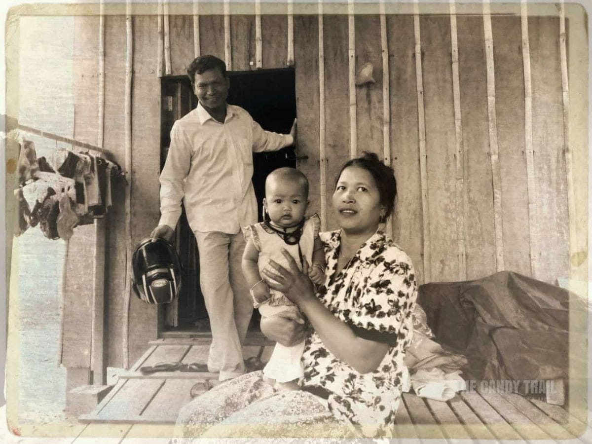 Cambodia Moto Driver At His Wooden House With Wife And Kid