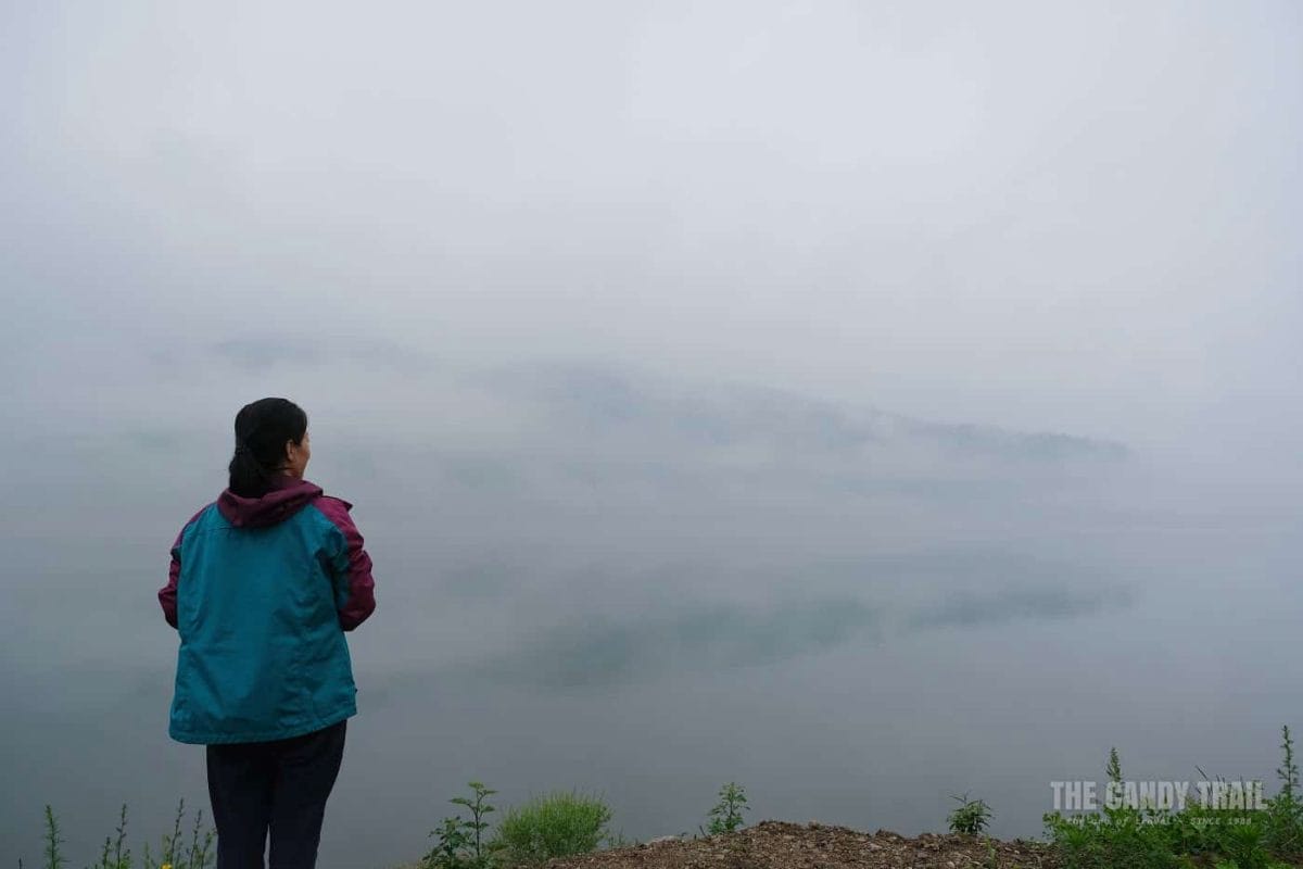 Woman Looking Towards North Korea Across Yalu River China