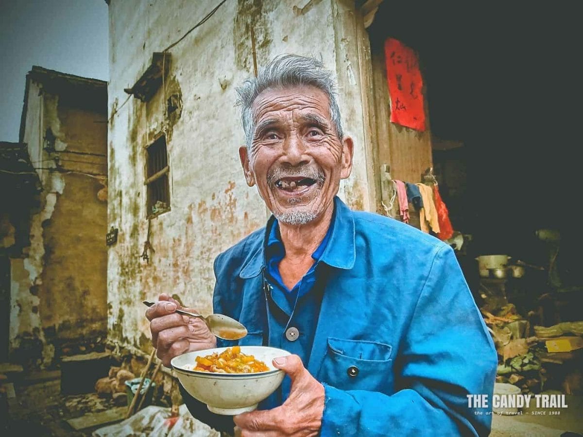 Old Chinese Guy Eating Noodles