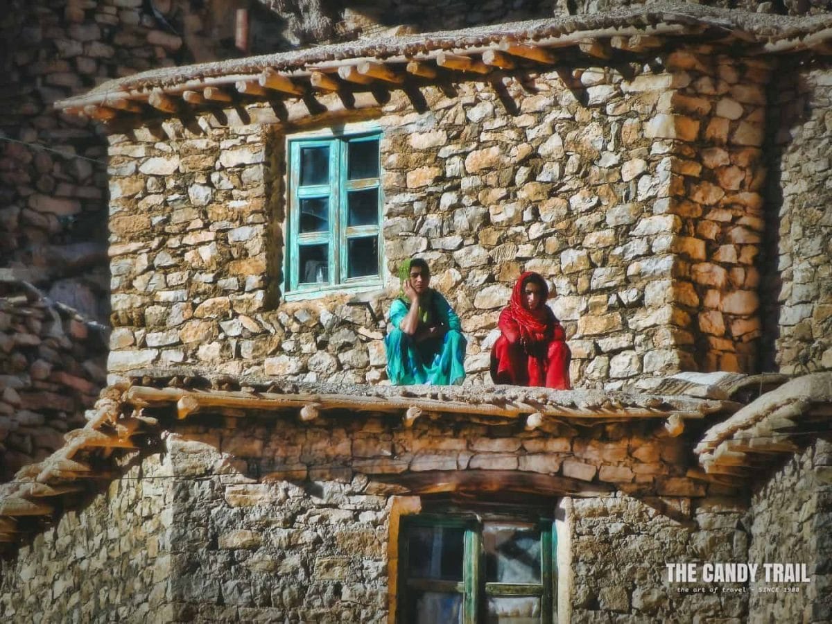 women on roof of palangan village iran