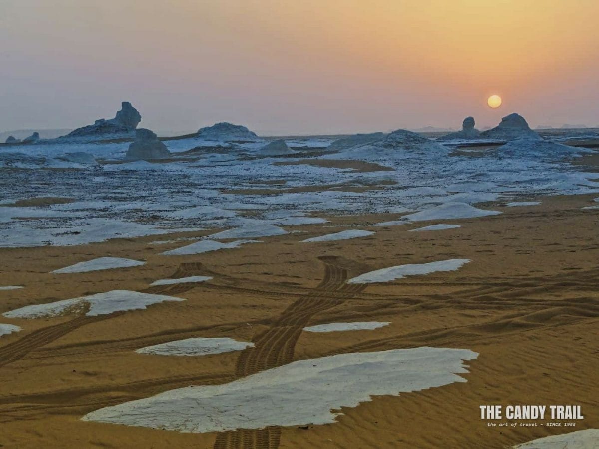sunset over strange white desert formations on tour in Egypt