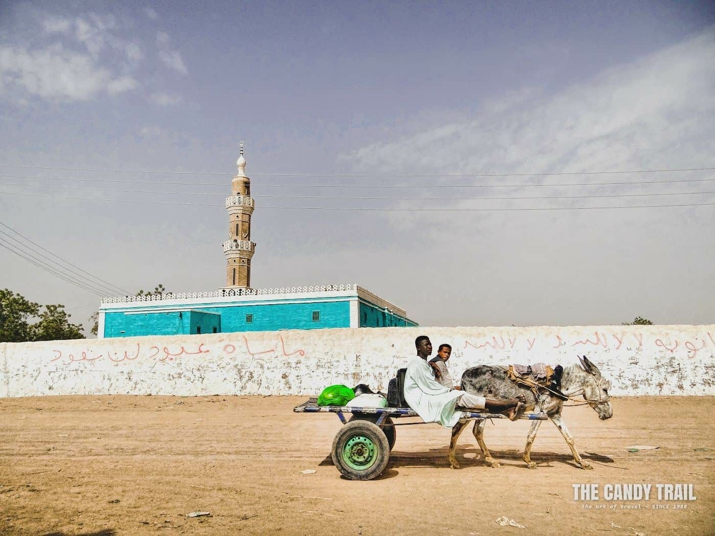 Donkey cart passing the Kerma mosque in sudan