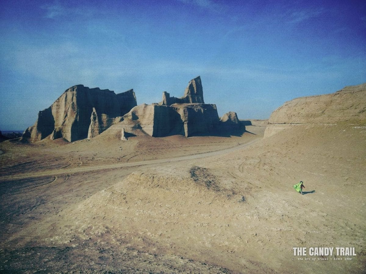 Girl with kite amid Kaluts of Iran.