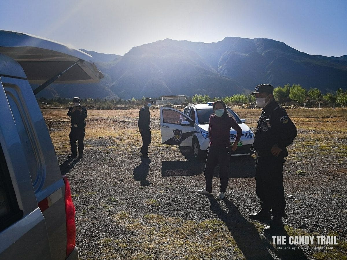 police check van in china during coronavirus 2020