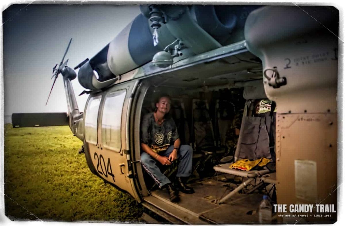Michael Robert Powell long term traveler in Blackhawk helicopter East Timor 2000