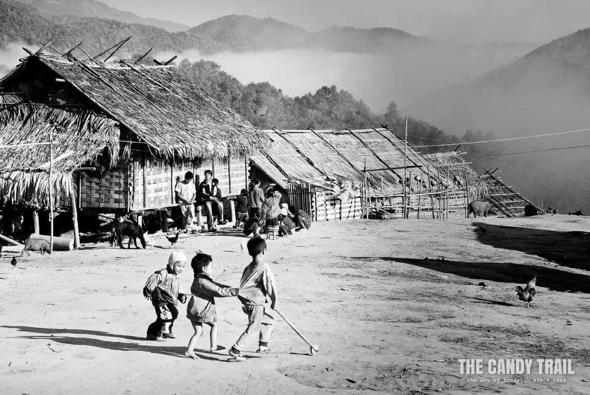 kids playing in akha hill tribe village in laos