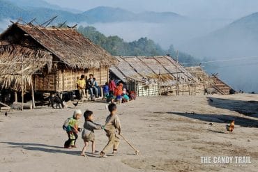 kids playing akha tribe village laos