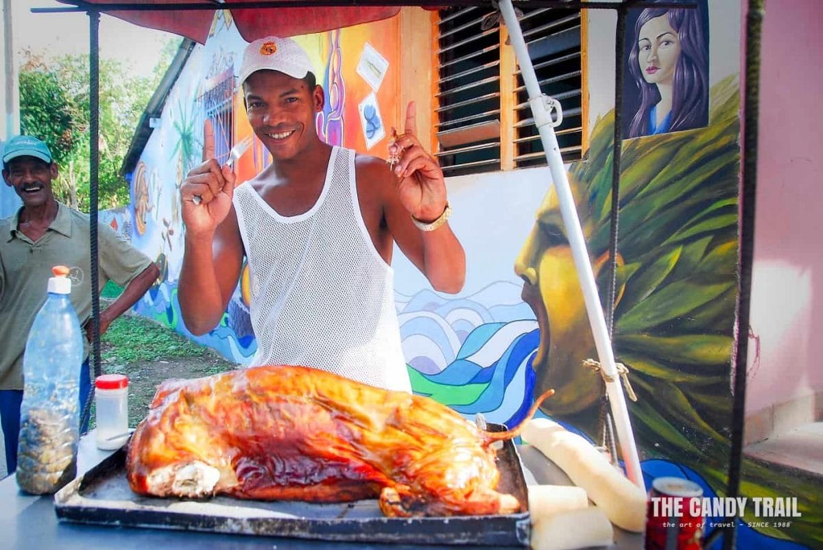 street vendor selling roast pork in cuba