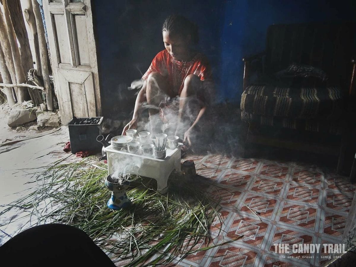 woman making traditional coffee in gondar ethiopia