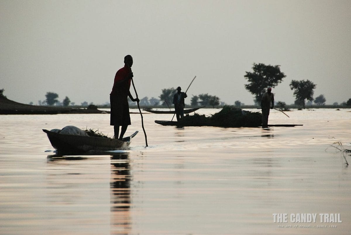 Canoes on river at dusk around Djenne.