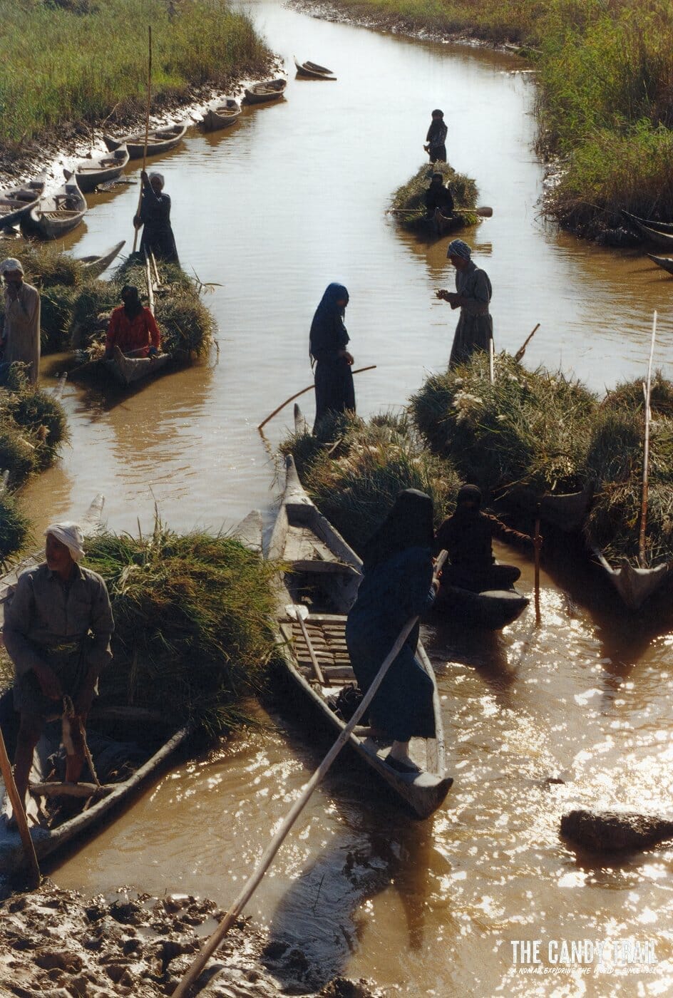 shia muslim women in canoes with reeds marsh arab culture iraq 1989