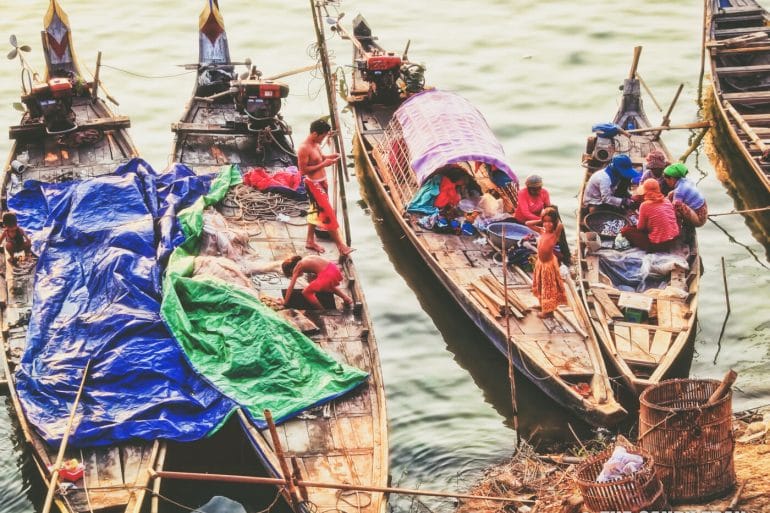 cham people amid fishing boats mekong river cambodia